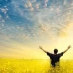 Man with open arms embracing life